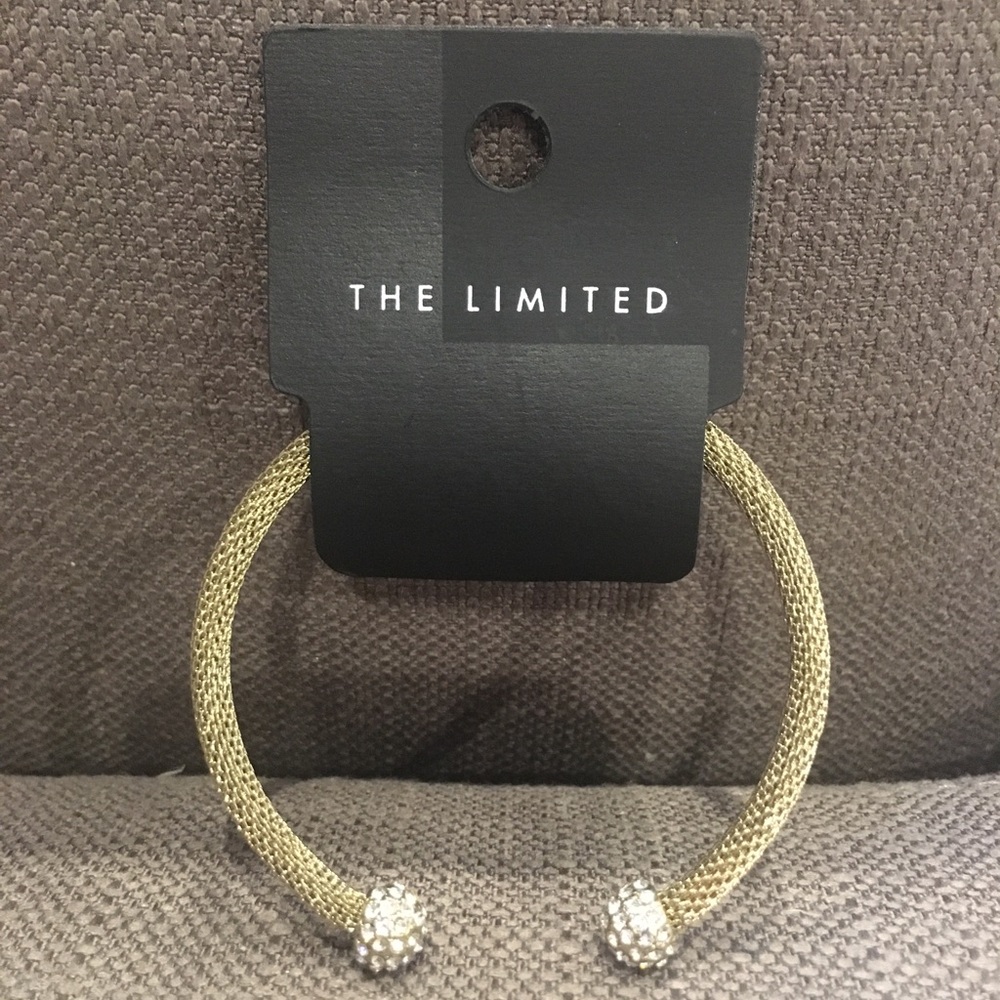 Gold cuff bracelet with gem stone details